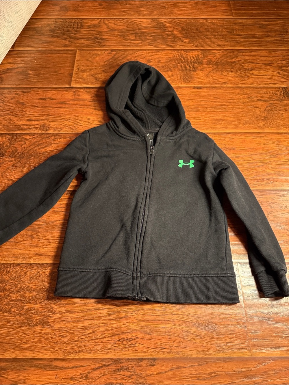 Under Armour Kids Black Zip-Up Hoodie with Green Logo. 5 toddler. Like new